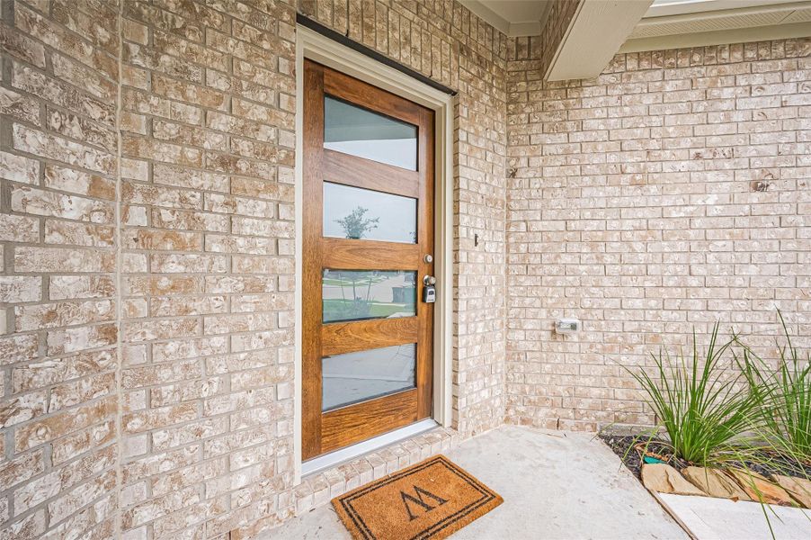 Exterior details and patio area of a home in Sunterra, Katy (Image 32).
