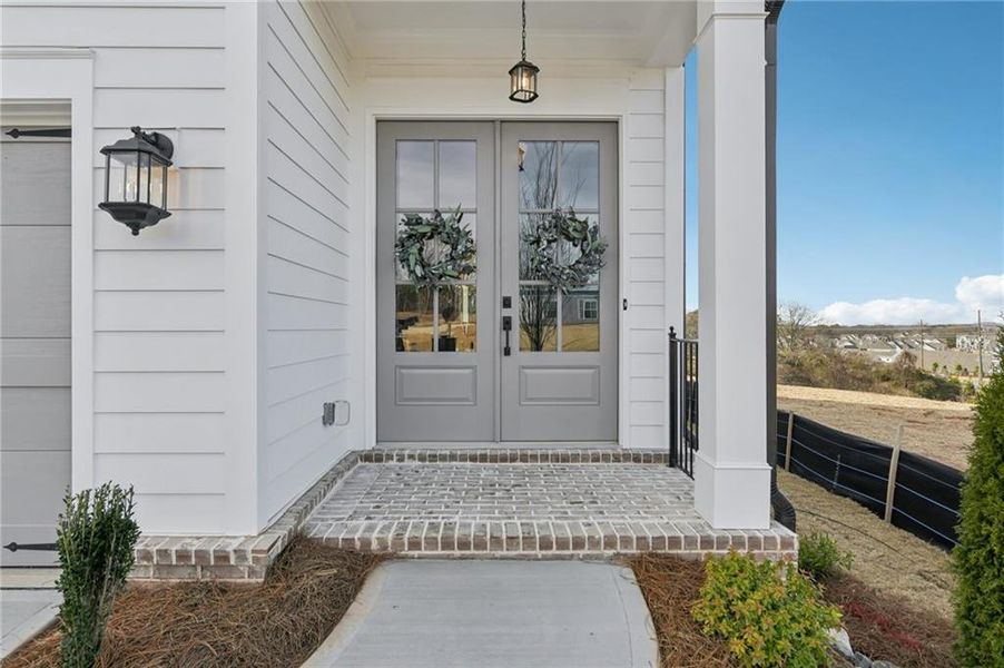 Exterior details and patio area of a home in Palisades Single Family, Cumming (Image 3).