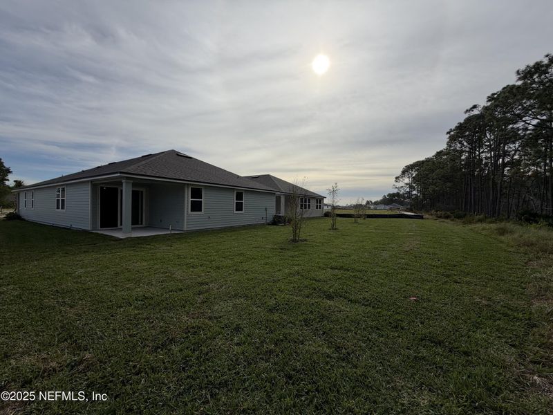 Exterior details and patio area of a home in The Magnolia Series at Reserve East, Flagler Beach (Image 22).