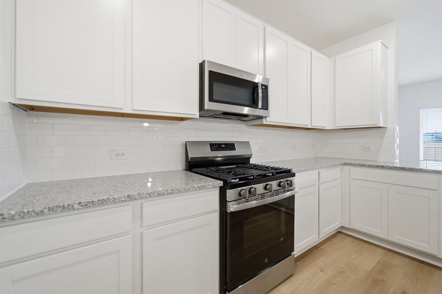 Furnished interior view inside a new home in Caney Mills, Conroe (Image 9).