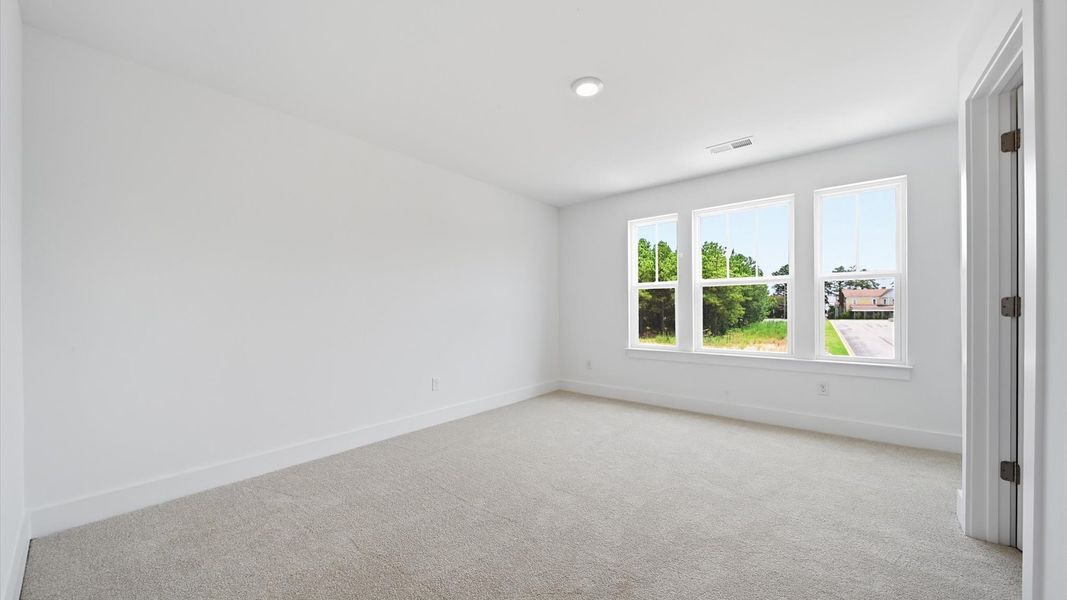 First-rate secondary bedroom with a spacious walk-in closet and elegant carpeted flooring First-rate secondary bedroom with a spacious walk-in closet and elegant carpeted flooring