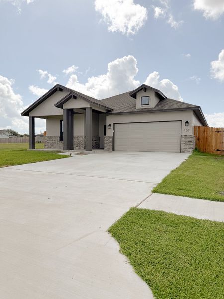 Front exterior of a new home in TerraVista, Victoria, TX, highlighting curb appeal (Image 29).
