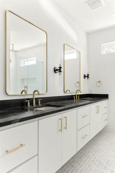 Bathroom with tile floors, double sink, and large vanity