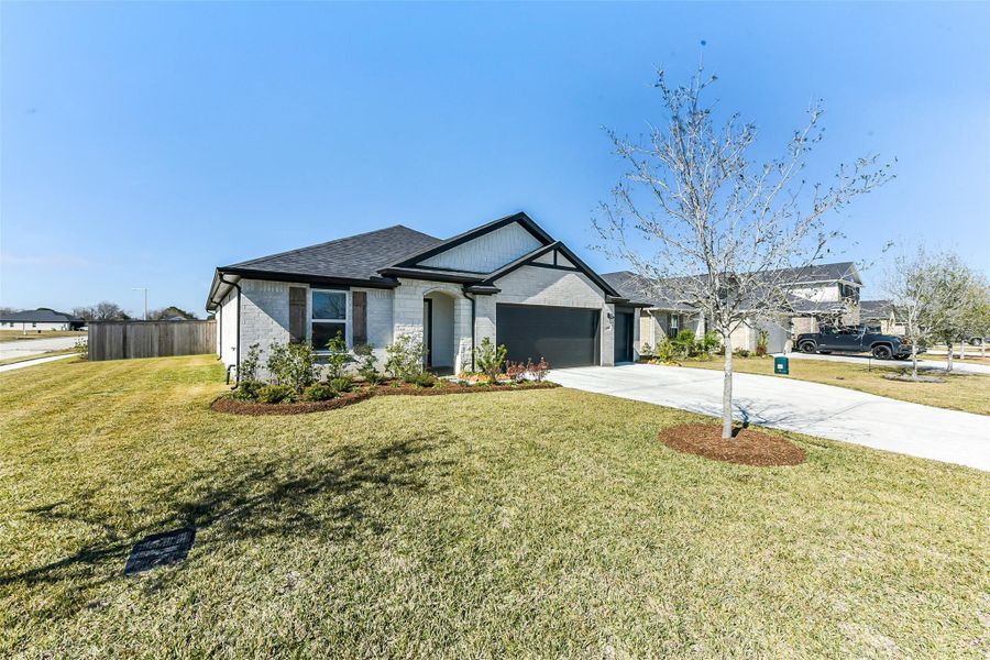 Front exterior of a new home in Sunrise Cove, Texas City, TX, highlighting curb appeal (Image 24).