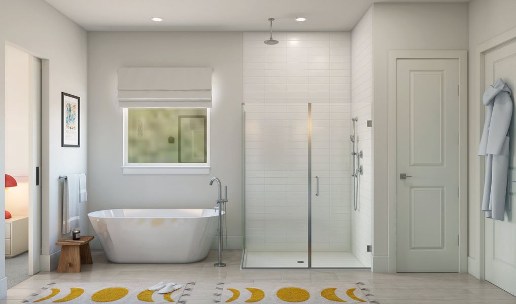 Primary bath with glass shower enclosure and freestanding tub