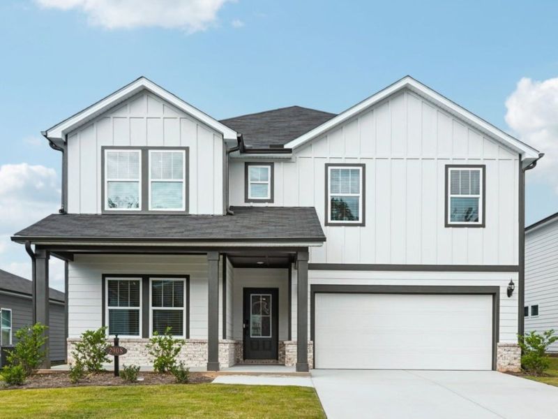 Front exterior of a new home in Vines at Mill Creek - Estate Series, Braselton, GA, highlighting curb appeal (Image 1).