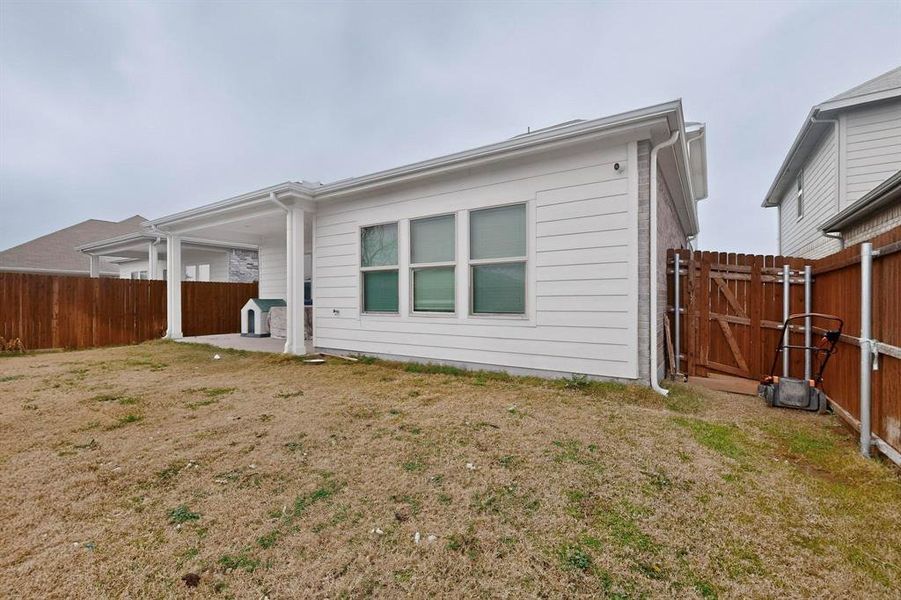 Back of house featuring a patio area and a gate Back of house featuring a patio area and a gate