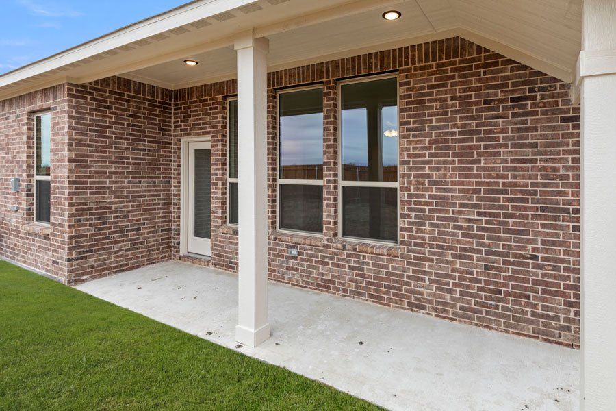 Representative exterior photo of a completed home built from the Kingston by Impression Homes in Timberbrook, Justin, TX (Image 29).