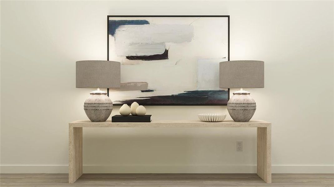 Home office featuring baseboards and wood finished floors Home office featuring baseboards and wood finished floors