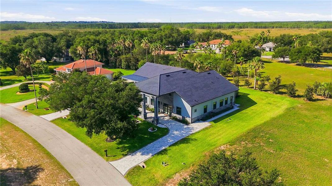 Front exterior of a new home in , Groveland, FL, highlighting curb appeal (Image 24).