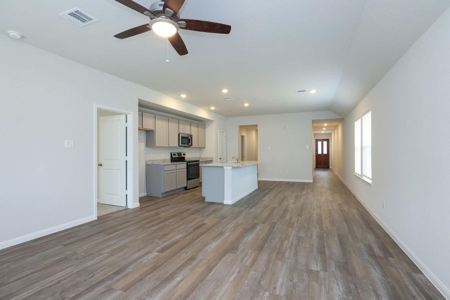 This view shows the sightlines to the front Entry and the hallway leading to the secondary bedrooms.