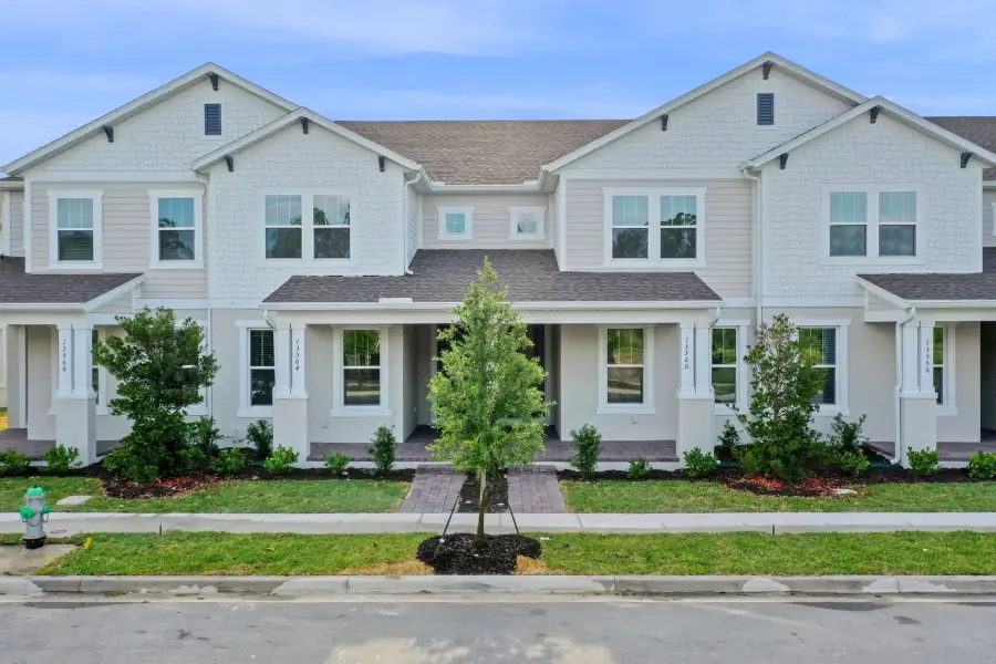 Representative exterior photo of a completed home built from the Edison by Rockwell Homes in Harvest at Ovation - Townhomes, Winter Garden, FL (Image 28).