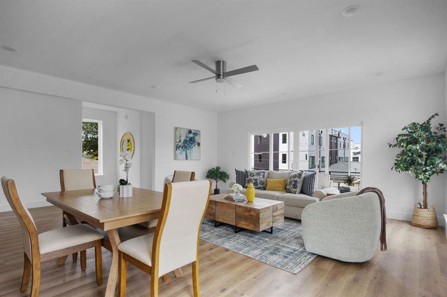 Dining area with light wood-type flooring and ceiling fan