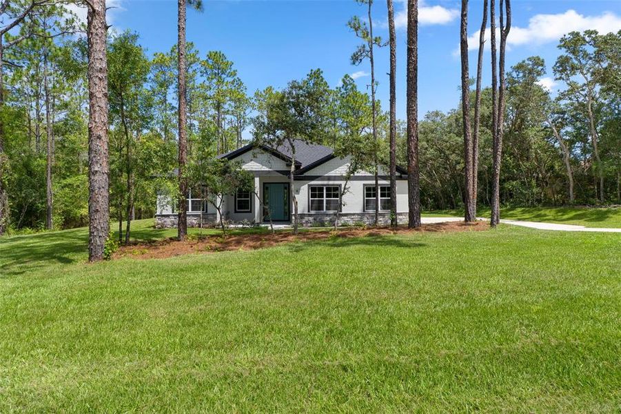 Front exterior of a new home in , Hernando, FL, highlighting curb appeal (Image 26). Front exterior of a new home in , Hernando, FL, highlighting curb appeal (Image 26).