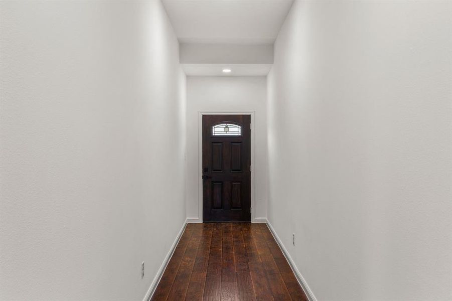 Doorway to outside with wood-type flooring