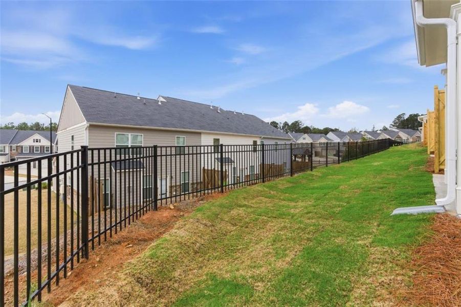 Exterior details and patio area of a home in Park Center Pointe, Mableton (Image 26).