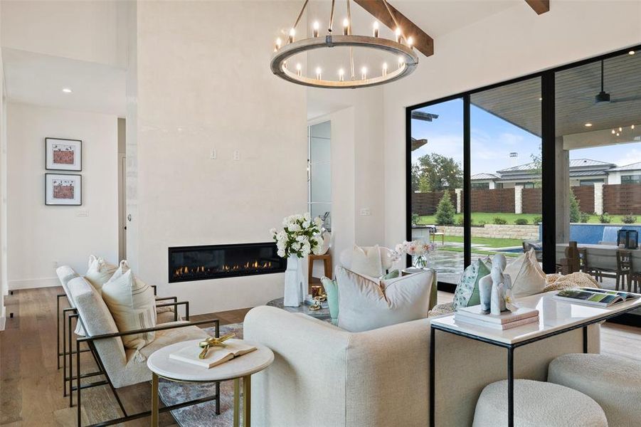 Venetian plaster two-sided fireplace off foyer and living room