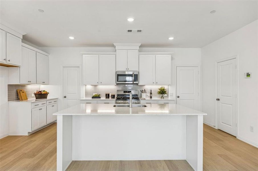 The large kitchen island makes the perfect gathering place for family and friends!