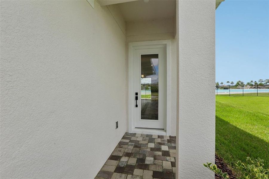 Exterior details and patio area of a home in Lagoon Residences at Epperson, Wesley Chapel (Image 25).