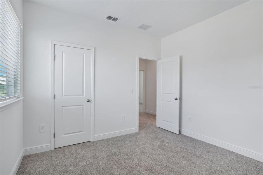 Spacious, unfurnished interior of a new home in Cyrene at Minneola - Villas, Montverde (Image 23). Spacious, unfurnished interior of a new home in Cyrene at Minneola - Villas, Montverde (Image 23).