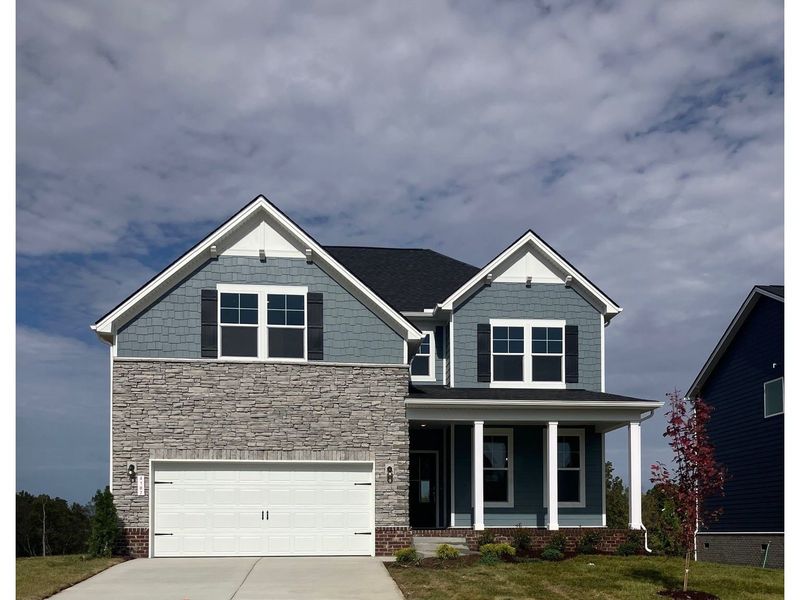 Front exterior of a new home in Calista Farms, White House, TN, highlighting curb appeal (Image 1). Front exterior of a new home in Calista Farms, White House, TN, highlighting curb appeal (Image 1).