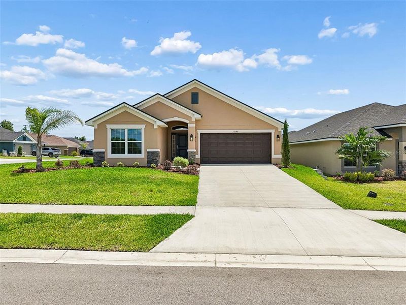 Front exterior of a new home in Abbey Glen, Dade City, FL, highlighting curb appeal (Image 29).