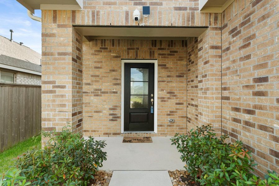 Exterior details and patio area of a home in Tavola: Gulf Coast Collection, New Caney (Image 27).