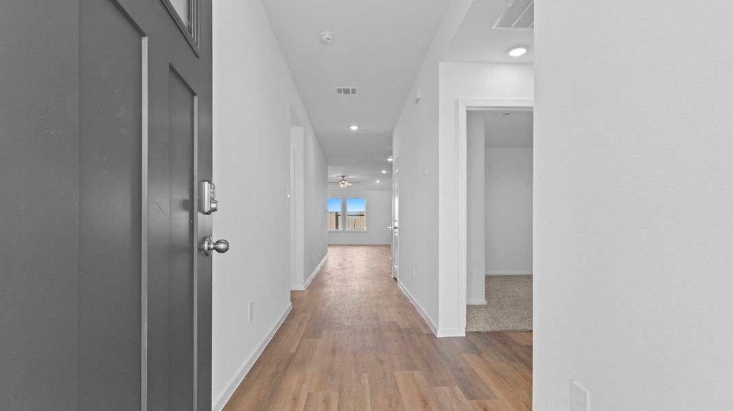 Spacious, unfurnished interior of a new home in Caldwell Crossing, Iowa Colony (Image 7).