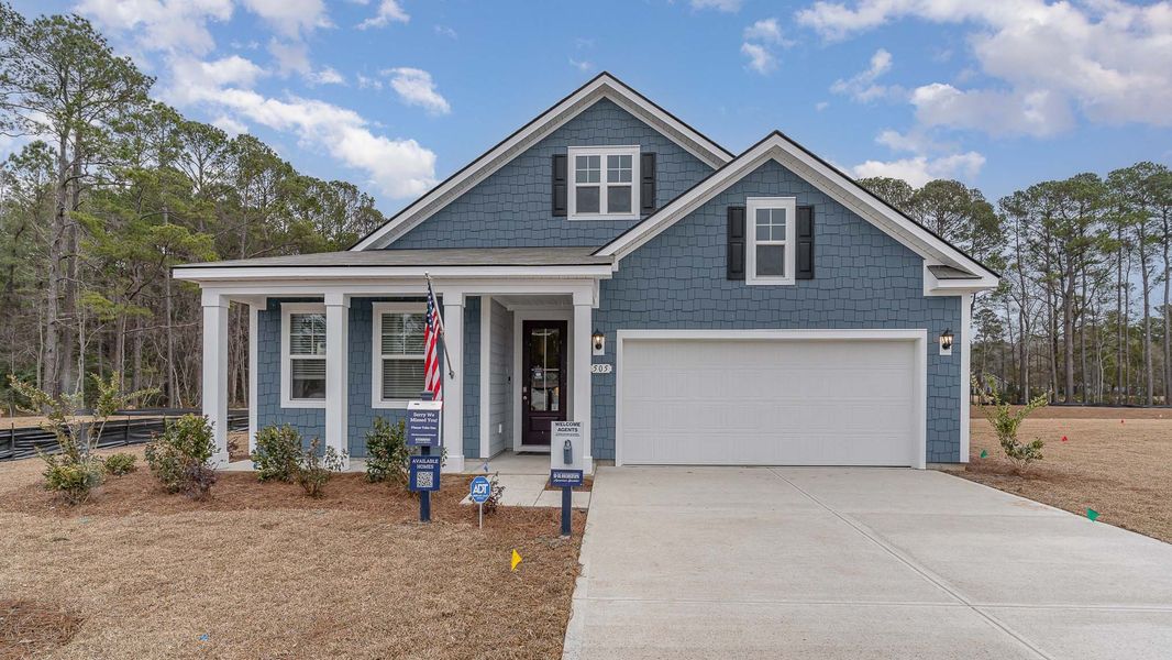 Representative exterior photo of a completed home built from the DARBY by D.R. Horton in The Reserve at Wild Horse, Conway, SC (Image 1).