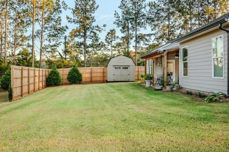 Exterior details and patio area of a home in Crossing Creeks, Monroe (Image 24).