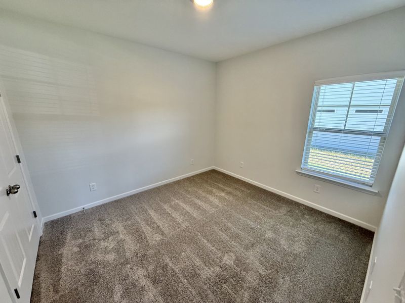 Spacious, unfurnished interior of a new home in Stone Fort Meadows, Manchester (Image 10).