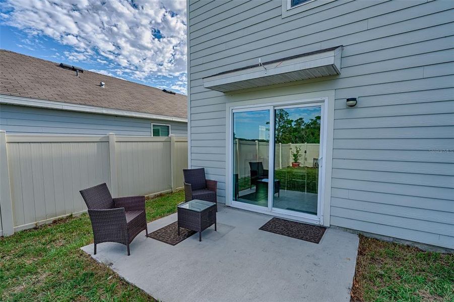 Front exterior of a new home in Avalon Woods, Newberry, FL, highlighting curb appeal (Image 2). Front exterior of a new home in Avalon Woods, Newberry, FL, highlighting curb appeal (Image 2).