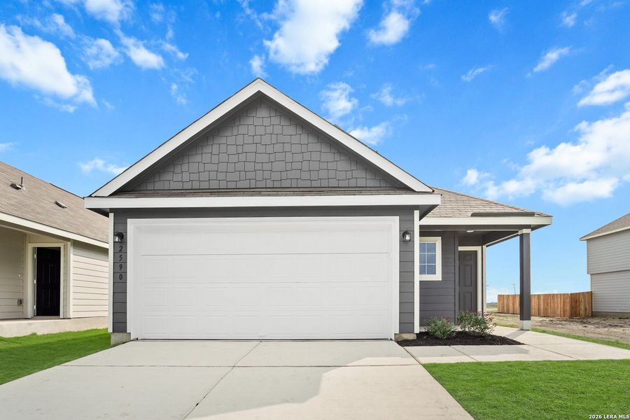 Front exterior of a new home in Dauer Ranch, New Braunfels, TX, highlighting curb appeal (Image 1). Front exterior of a new home in Dauer Ranch, New Braunfels, TX, highlighting curb appeal (Image 1).