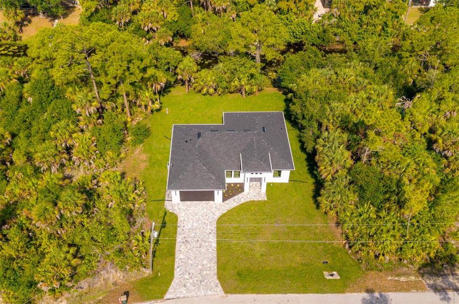 Front exterior of a new home in , North Port, FL, highlighting curb appeal (Image 33). Front exterior of a new home in , North Port, FL, highlighting curb appeal (Image 33).