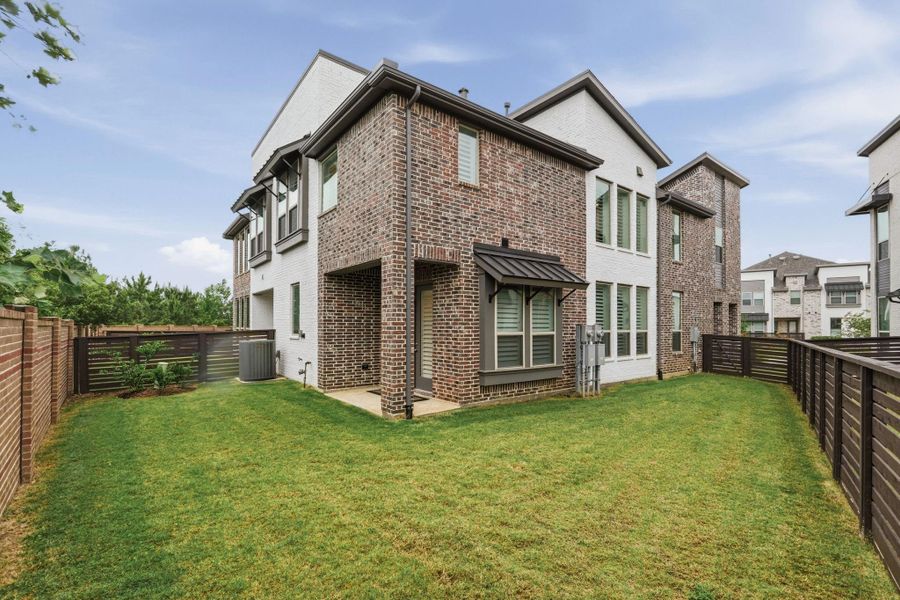 Exterior details and patio area of a home in Bridgeland Central, Cypress (Image 25).