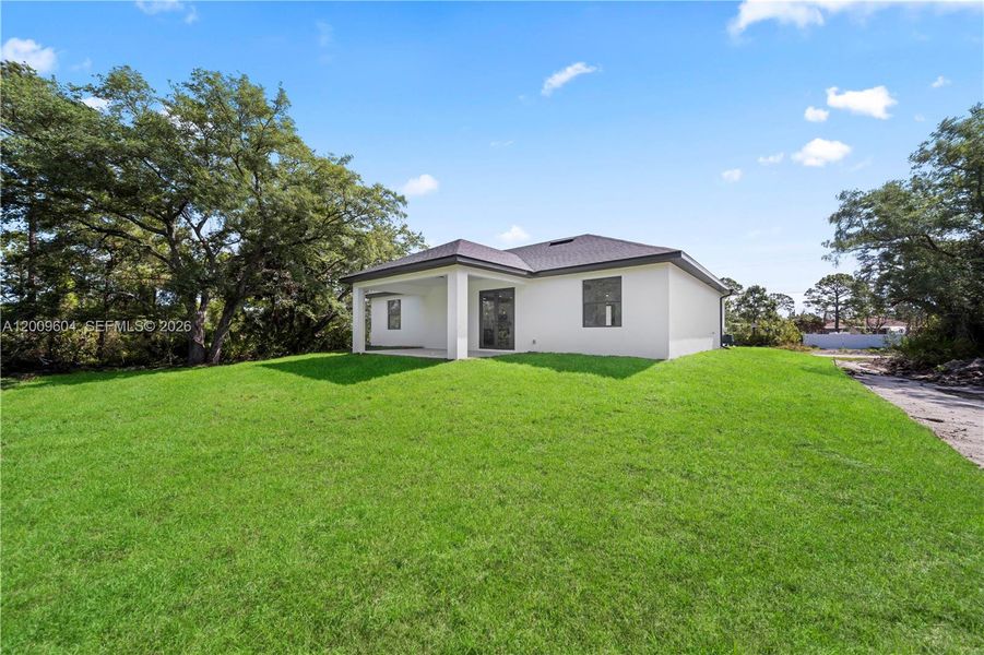 Exterior details and patio area of a home in , Lehigh Acres (Image 4).