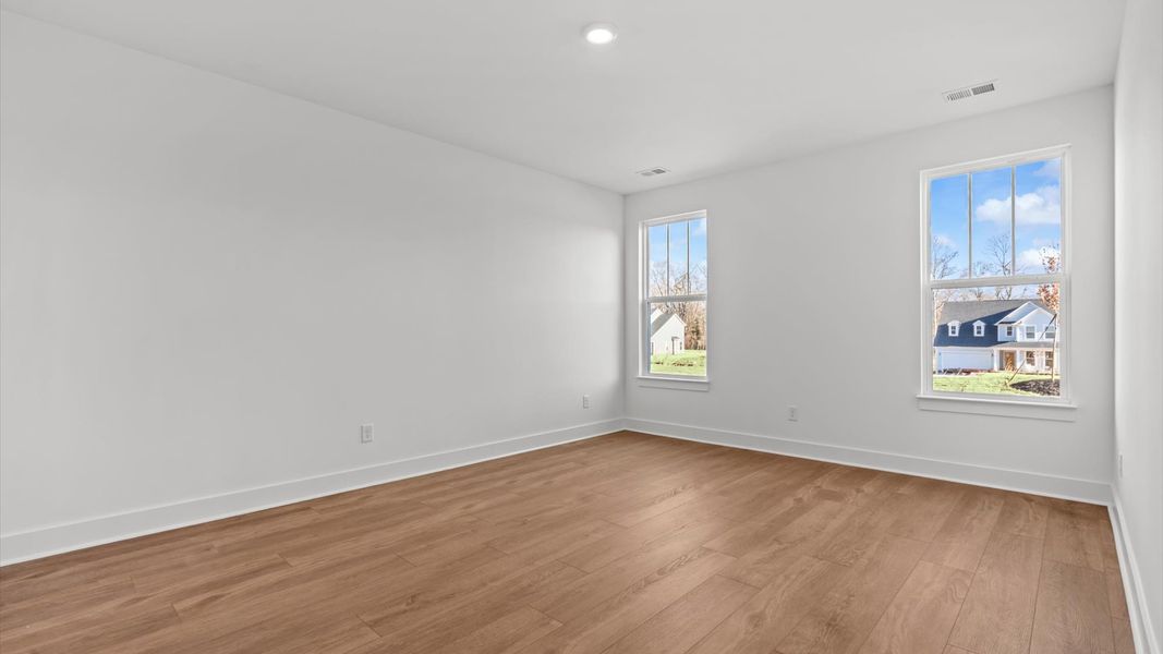 Memorable mornings begin in this tasteful and thoughtfully crafted primary suite