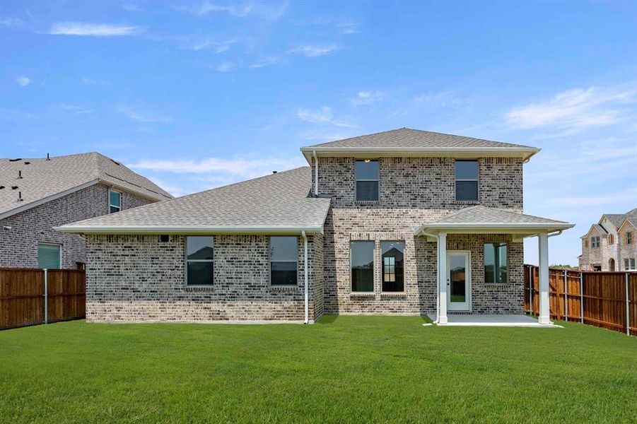 Front exterior of a new home in Brookshire at Legacy Hills-60s, Celina, TX, highlighting curb appeal (Image 20).