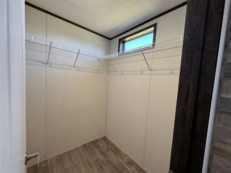 Spacious closet with wood finished floors