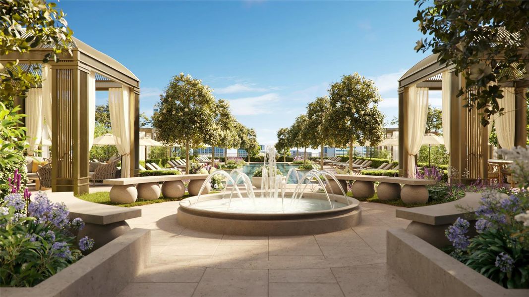The serene fountain courtyard is outlined by lush greenhouses.