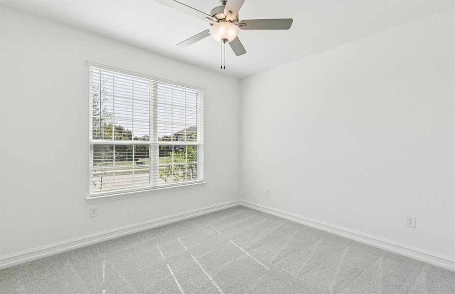 Secondary bedroom with large windows Secondary bedroom with large windows