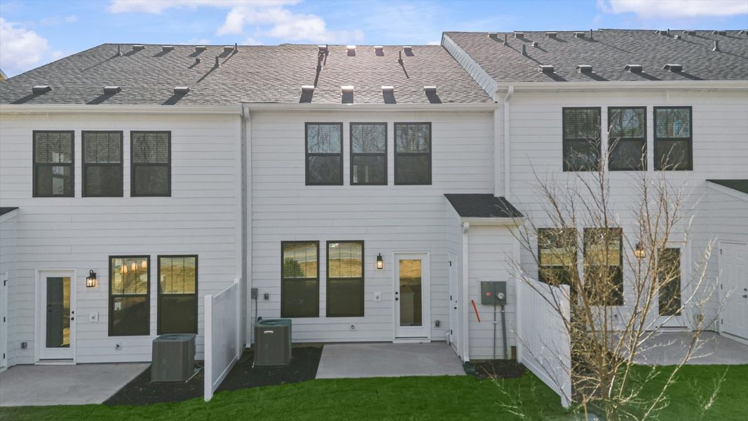 Accomplished rear exterior of the Litchfield model with a spacious backyard in Simpsonville, SC