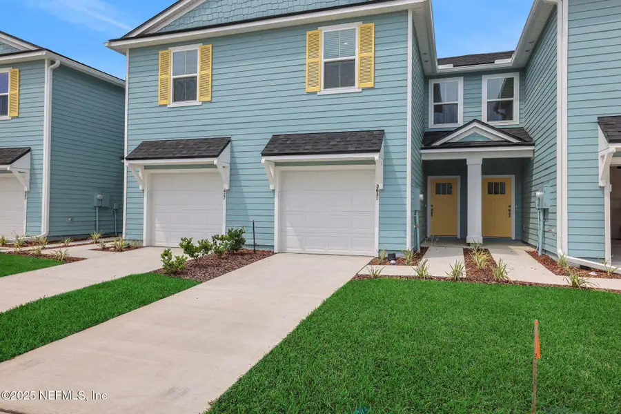 Front exterior of a new home in Atlantis Pointe, Middleburg, FL, highlighting curb appeal (Image 16).