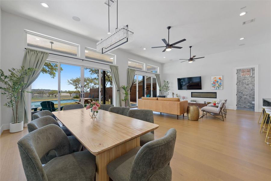 Soaring ceilings, expansive windows, and open-concept living define this light-filled Canyon Lake home. The seamless flow from dining to living space invites both relaxed mornings and lively entertaining—all framed by peaceful Hill Country views.