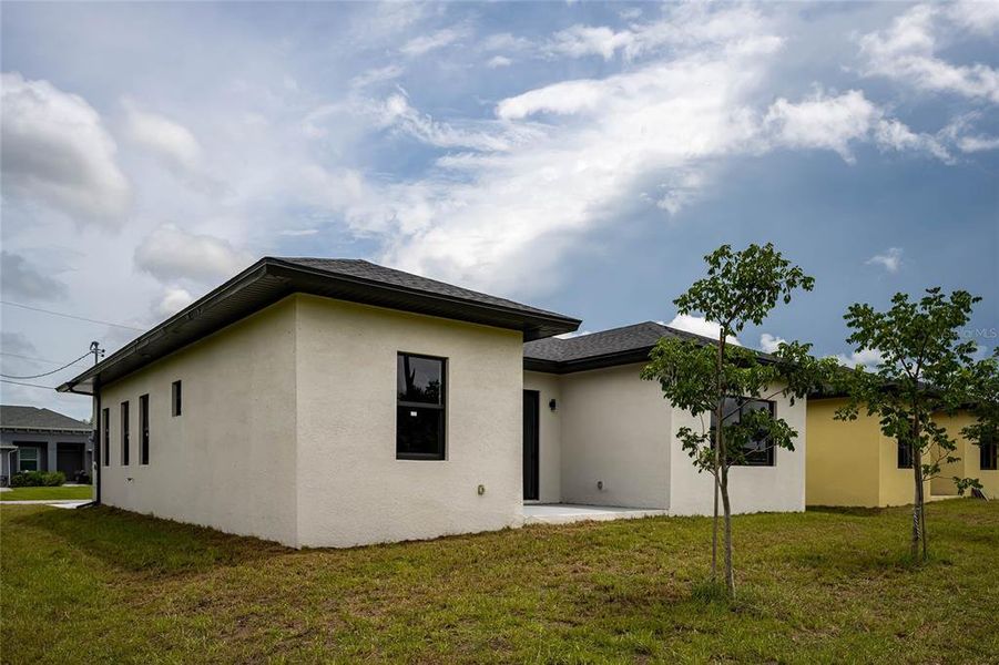 Front exterior of a new home in , Rotonda West, FL, highlighting curb appeal (Image 2).