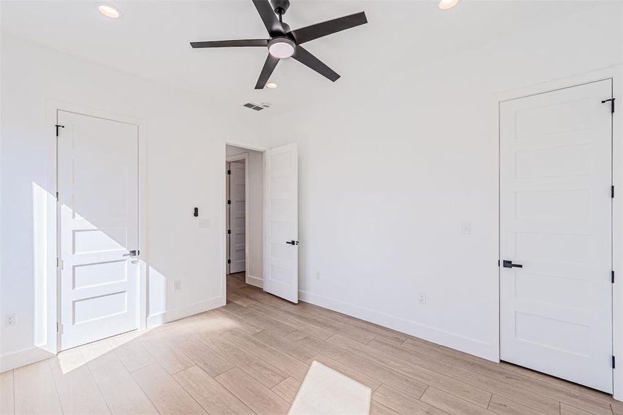 Unfurnished bedroom featuring light wood-style floors, recessed lighting, and ceiling fan