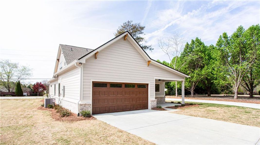 Front exterior of a new home in , Grayson, GA, highlighting curb appeal (Image 24).