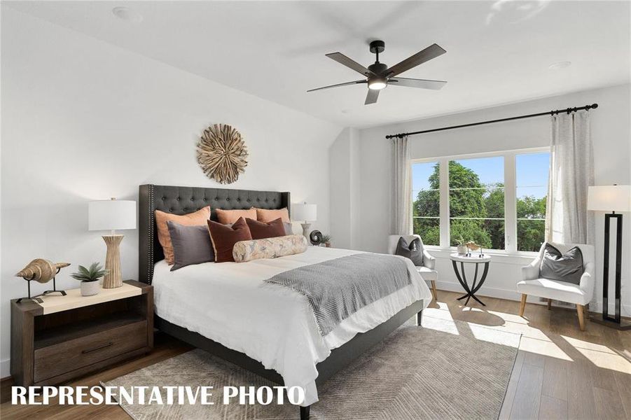 Bedroom featuring ceiling fan and carpet flooring