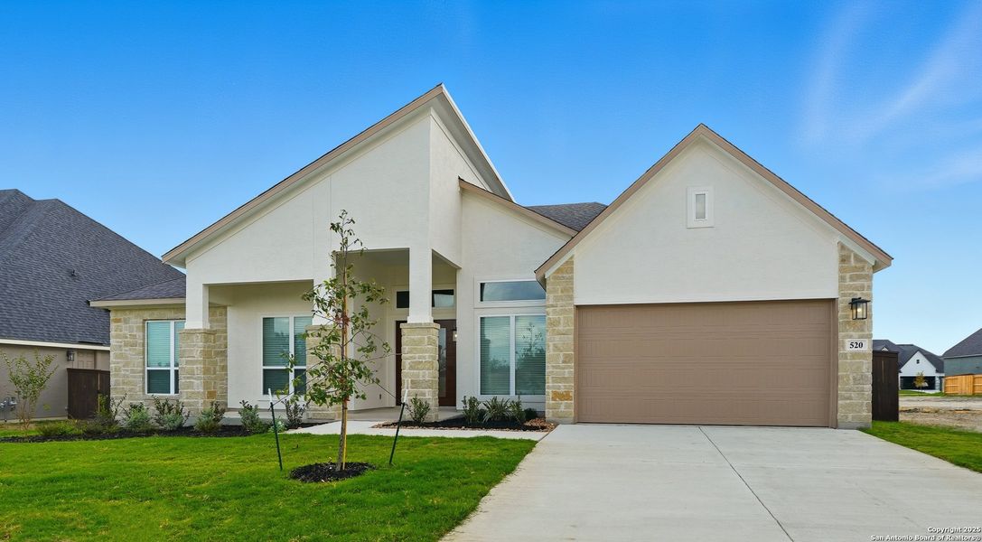 Front exterior of a new home in Mesa Western, Cibolo, TX, highlighting curb appeal (Image 1). Front exterior of a new home in Mesa Western, Cibolo, TX, highlighting curb appeal (Image 1).