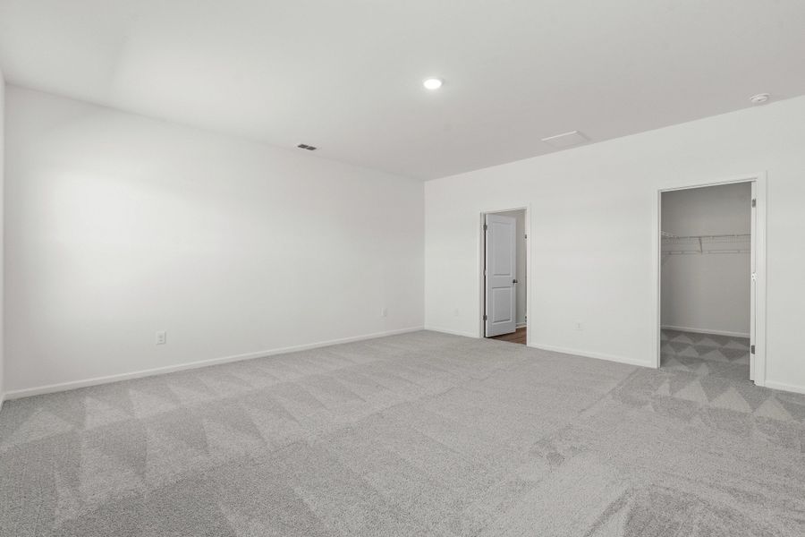 Representative unfurnished interior of a home built from the Europa by Starlight Homes in Oakfield Lakes, Parrish (Image 16).